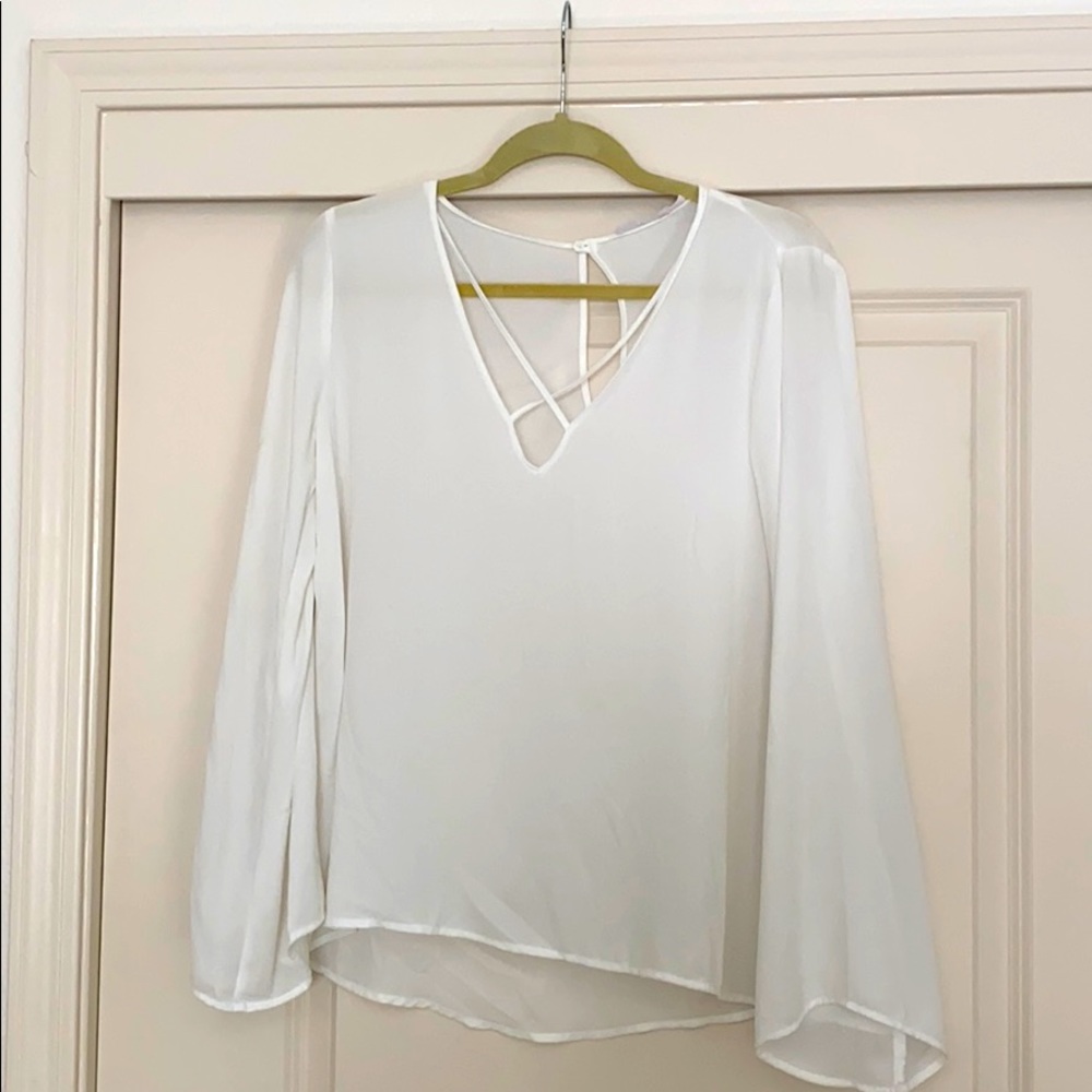 White long sleeve blouse with crisscross detail